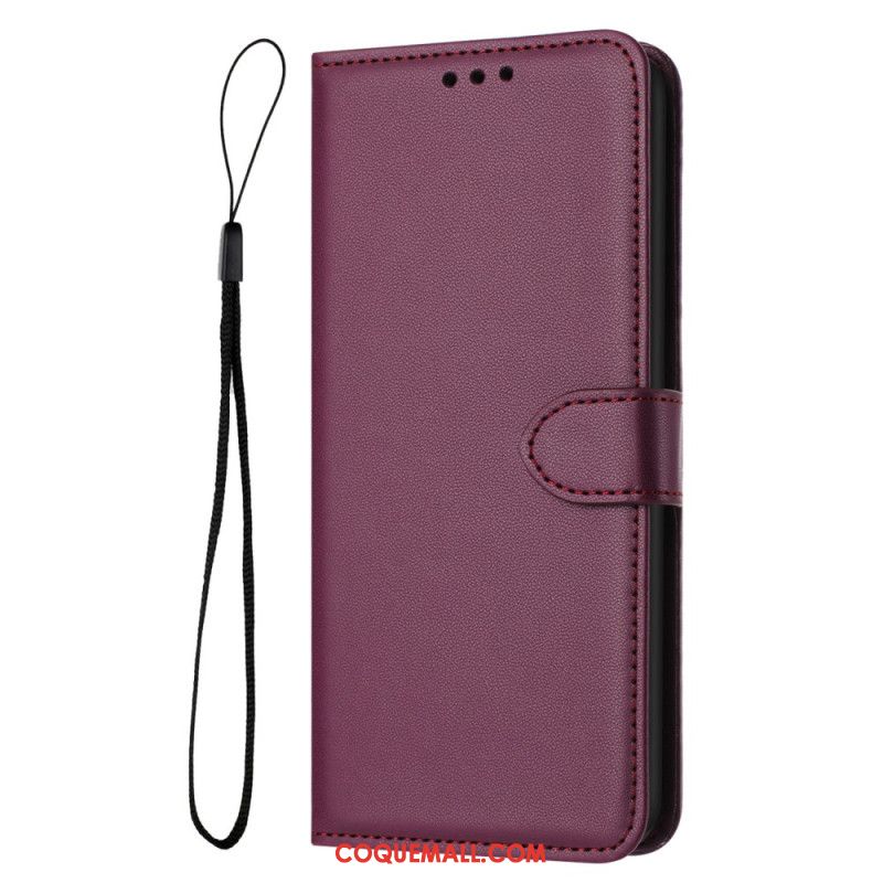 Housse iPhone 16 Plus Style Cuir Uni à Lanière